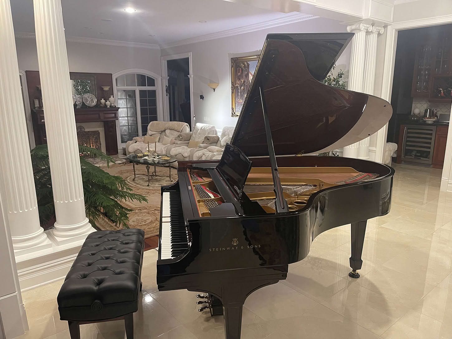 Restored 1922 Steinway Model O grand piano in polished ebony in a client's home in Holmdel, New Jersey