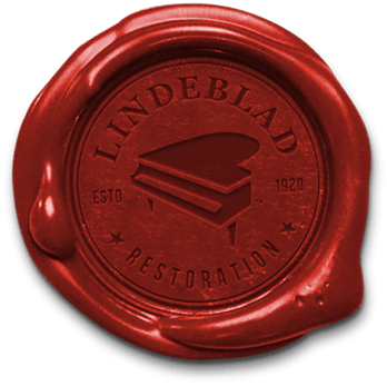 Lindeblad logo pressed in red wax seal.