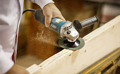 Technician working on a piece of wood.
